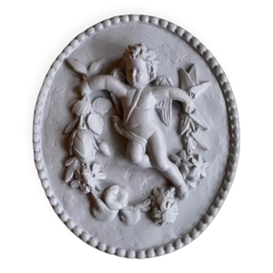 Plaster medallion cherub and garland of flowers patinated gray