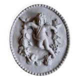 Plaster medallion cherub and garland of flowers patinated gray