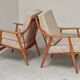 Pair of Boomerang-style armchairs in ecru beige fabric, 1960s.
