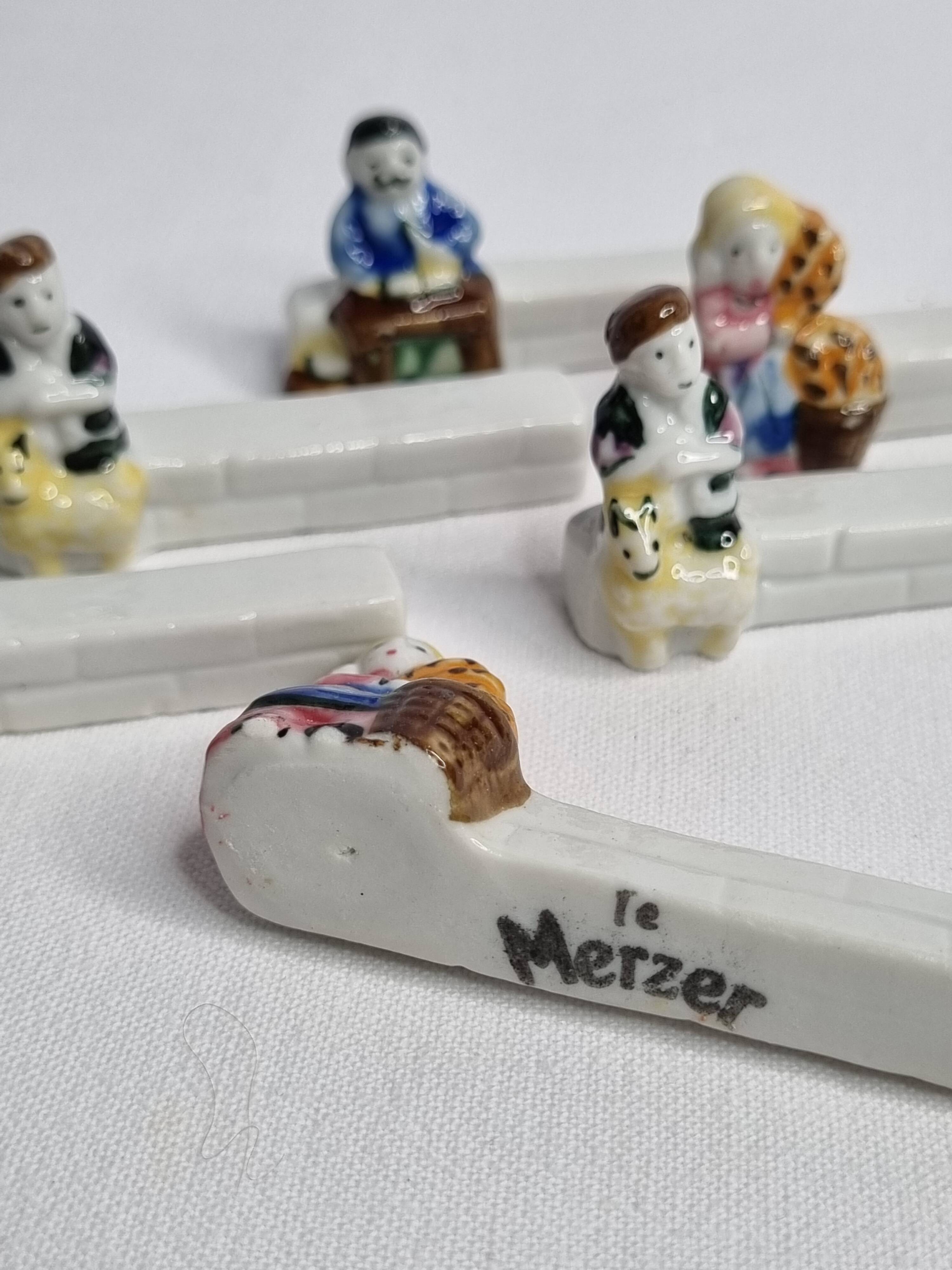 Six Le Merzer porcelain knife holders, 6 cm