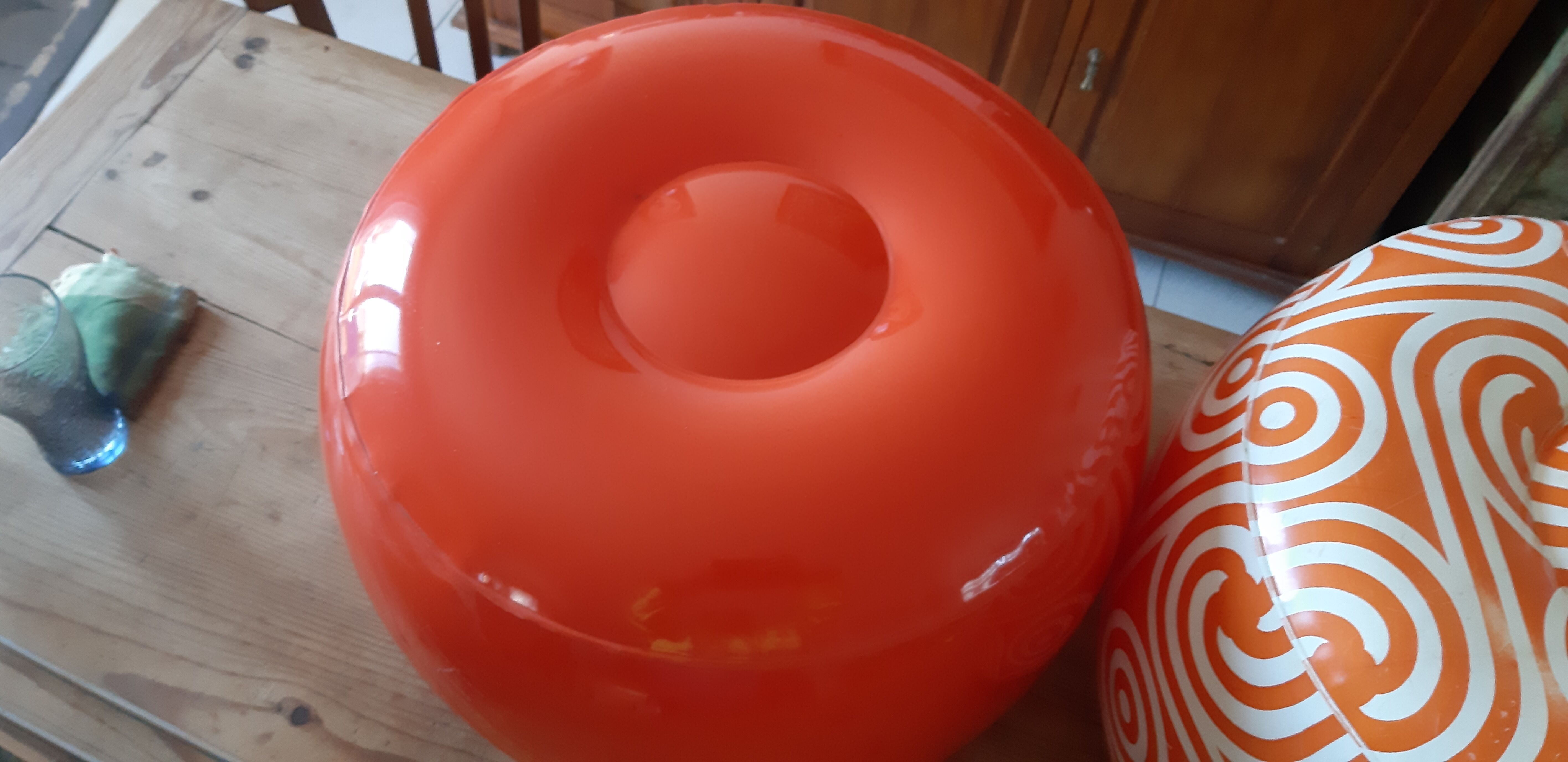 2 vintage inflatable poufs in orange plastic