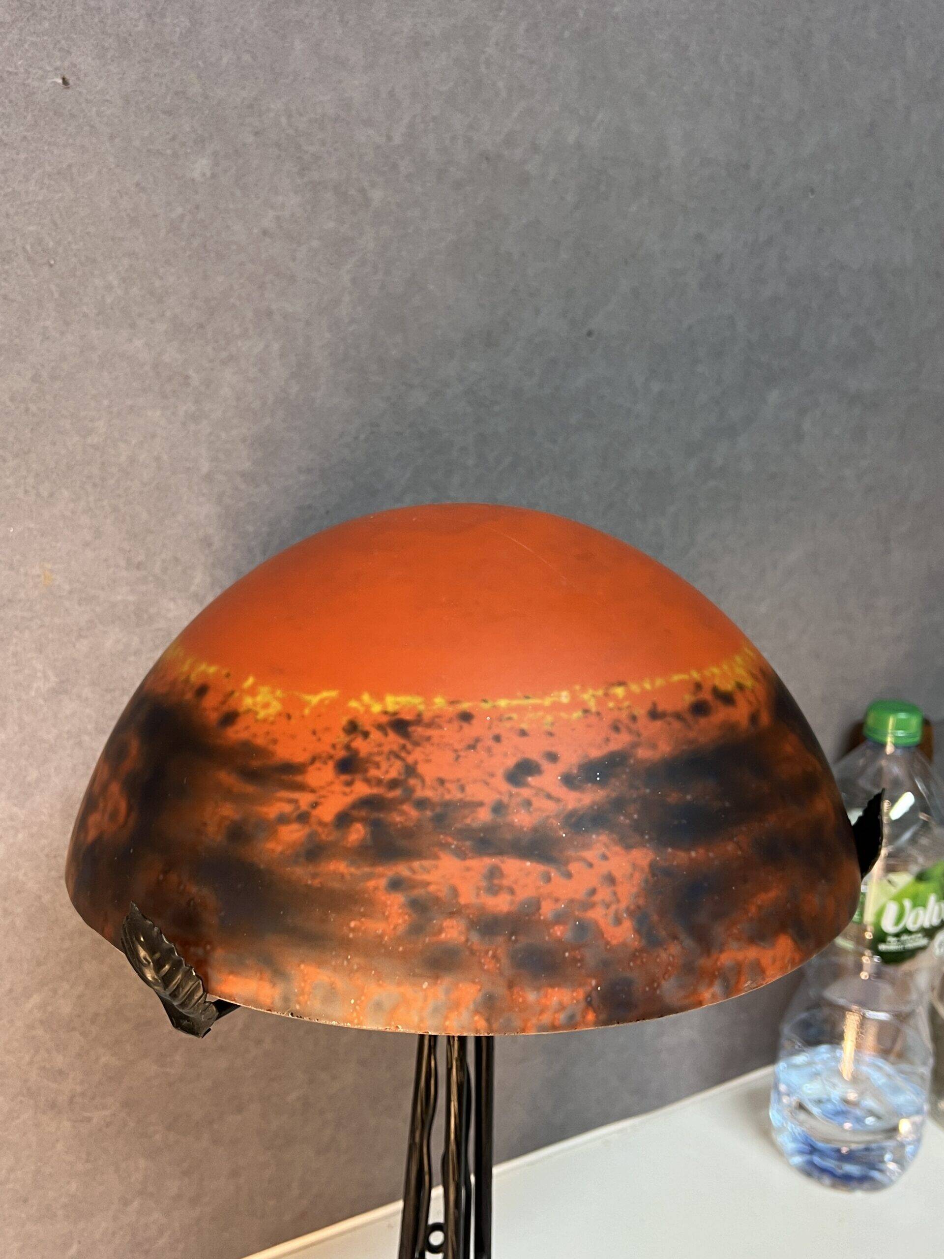 Contemporary mushroom lamp, wrought iron base and shaded orange glass shell