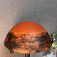 Contemporary mushroom lamp, wrought iron base and shaded orange glass shell