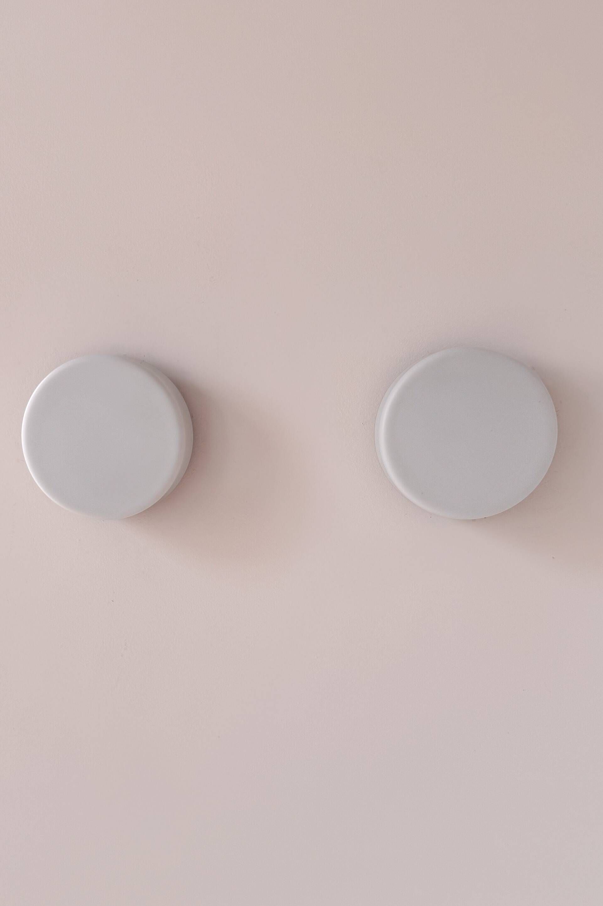 Pair of vintage wall lights in black Bakelite and frosted opal glass, France 1970.