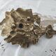 Hand-held candle holder called "cellar rat" in brass with vine leaf decoration