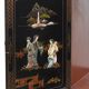 Black lay cabinet with Chinese décor
