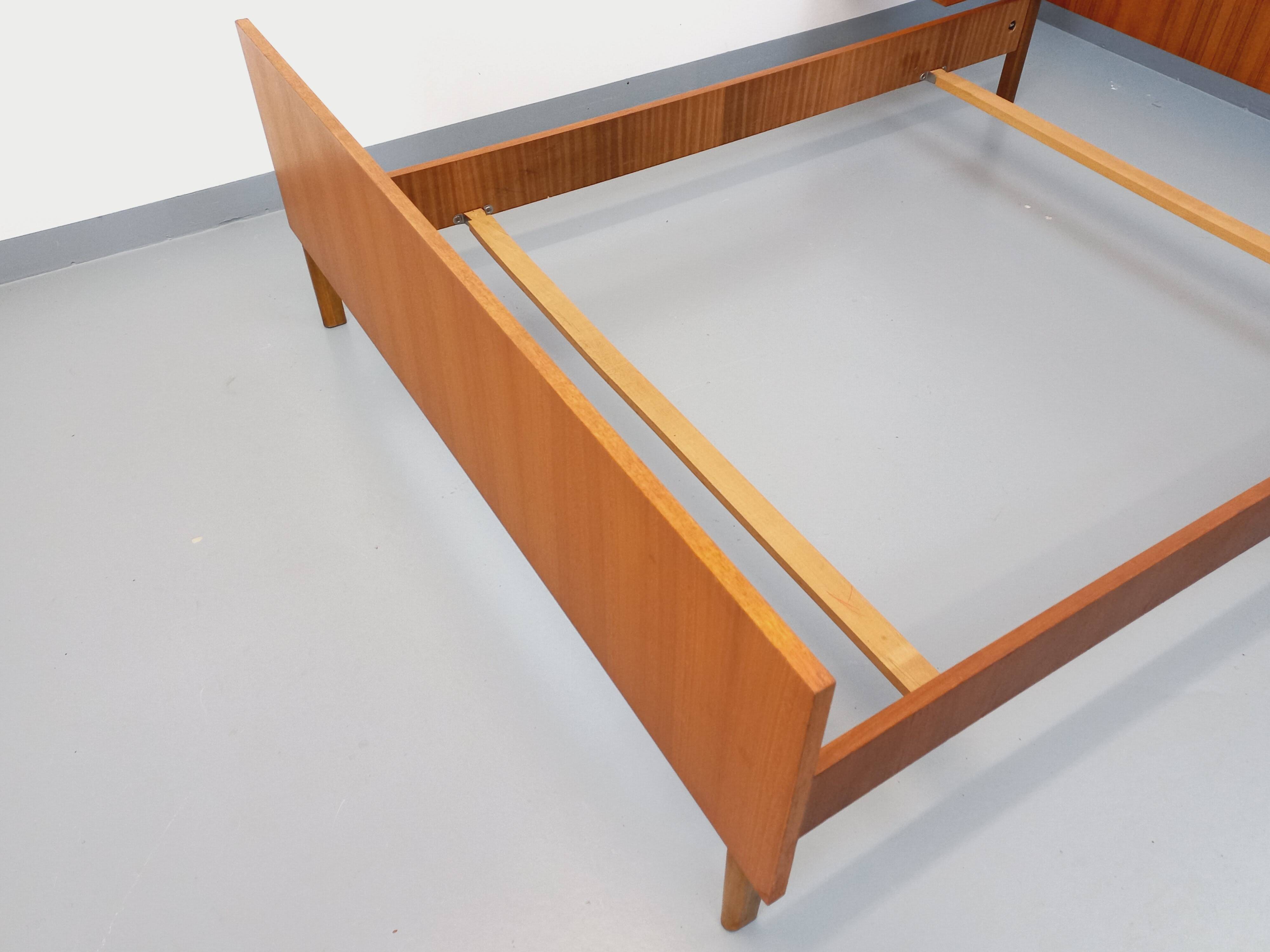 Vintage Scandinavian style double bed in teak from the 60s with integrated bedside lights