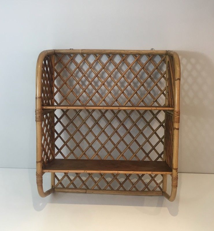 Rattan wall shelf. Attributed to Audoux-Minet