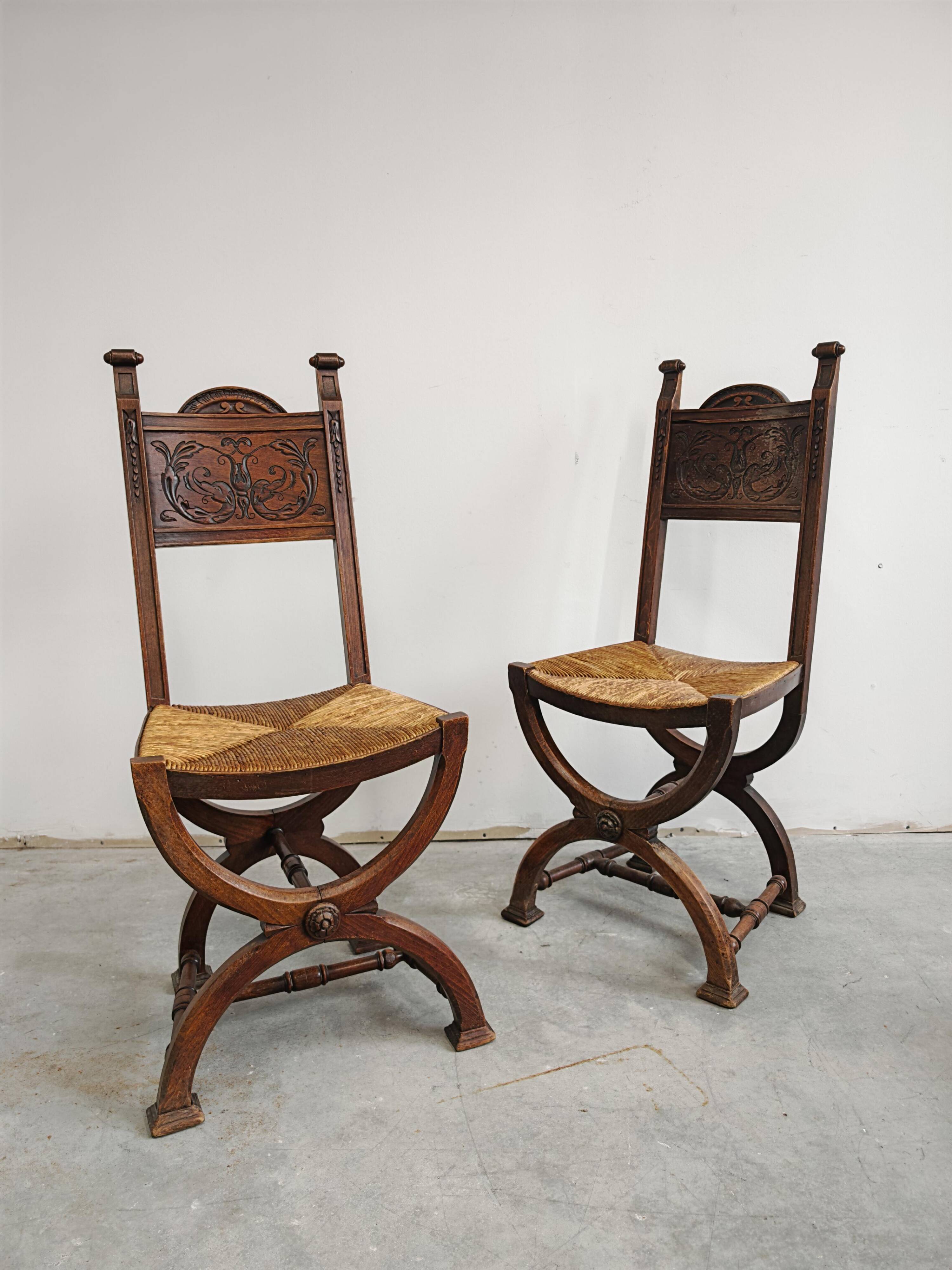 Pair of Neo-Renaissance oak chairs with straw seats, 1910
