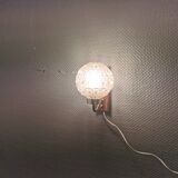 Wall light in rosewood with bobble glass ball shade.