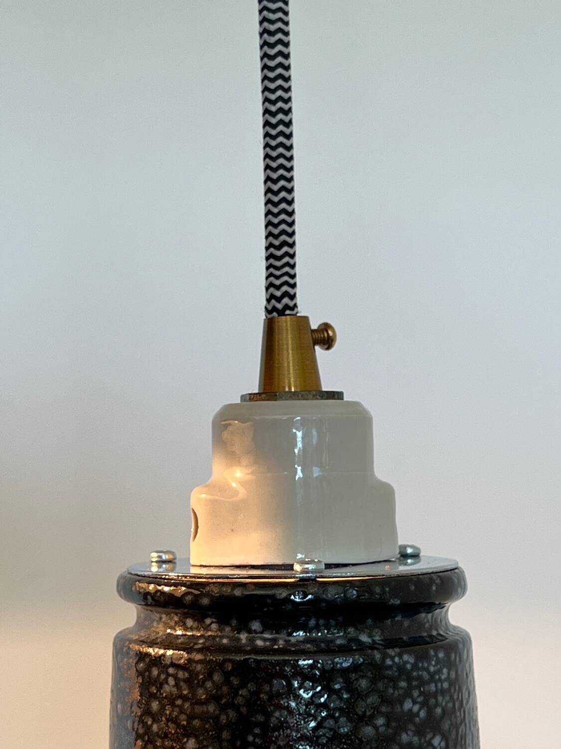 Pair of black and white industrial pendant lights with ceramic sockets