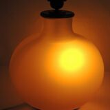 Vintage frosted glass lamp, round globe, elegant design, soft light.