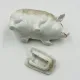 Vintage mustard pot in porcelain shaped like a pig.