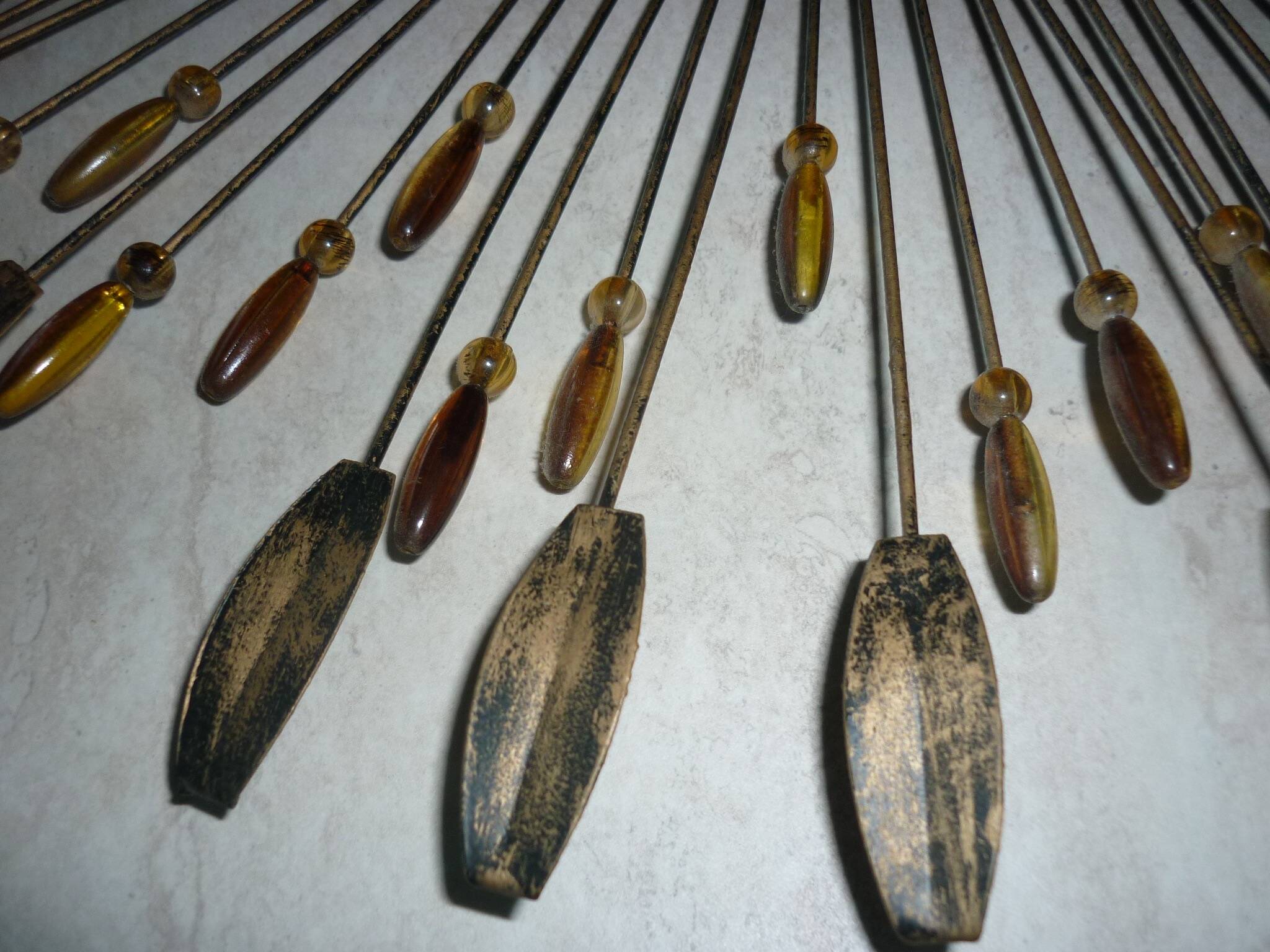 Round sun mirror with pearl rays and leaves