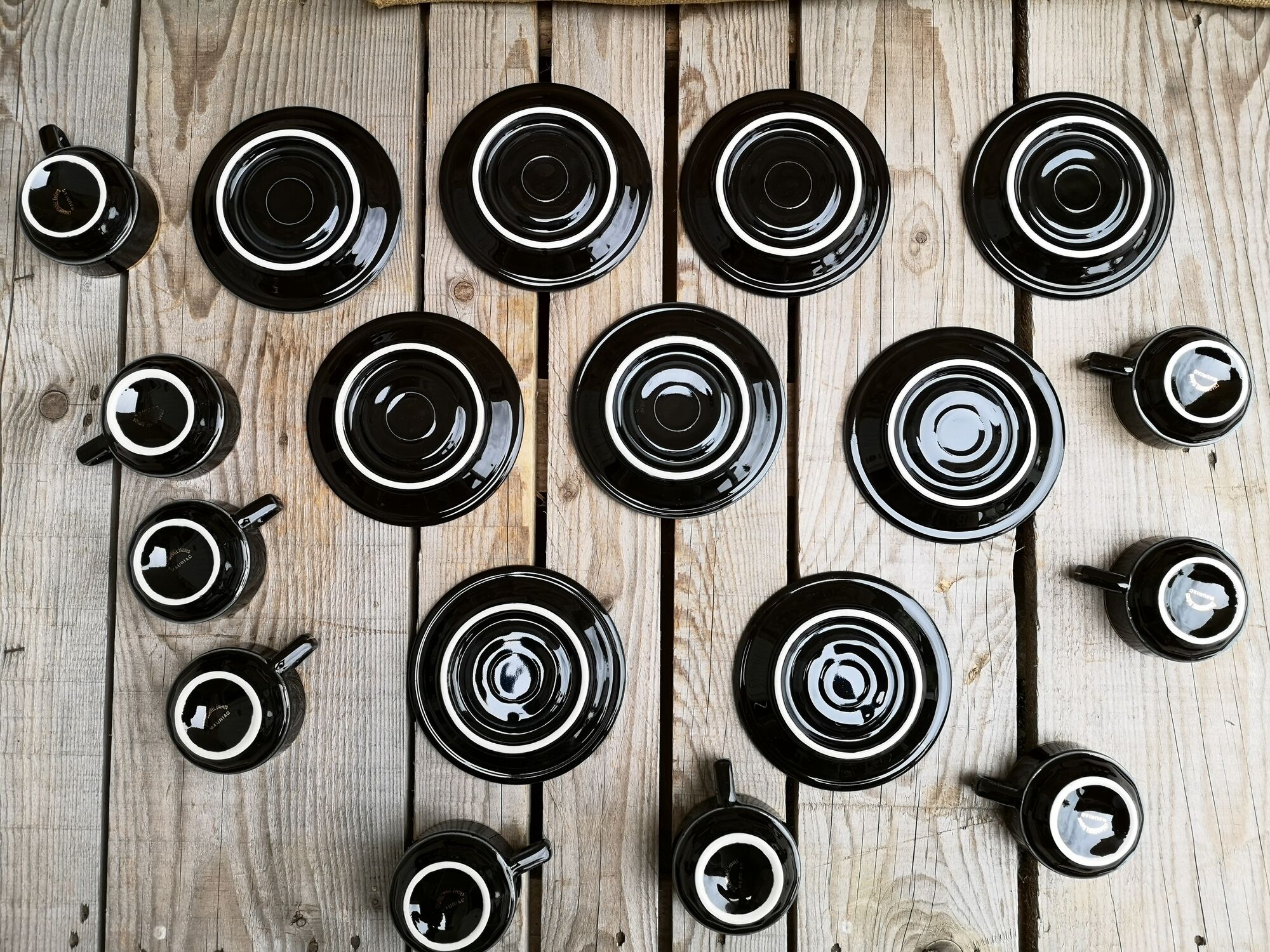 Set of 9 cups and sub-cups in black ceramic and colored gold border
