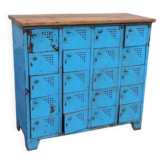 Old blue metal locker with wooden top