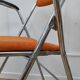 Chaise orange pliable