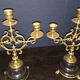 Elegant pair of three-light candelabra in gilded bronze.