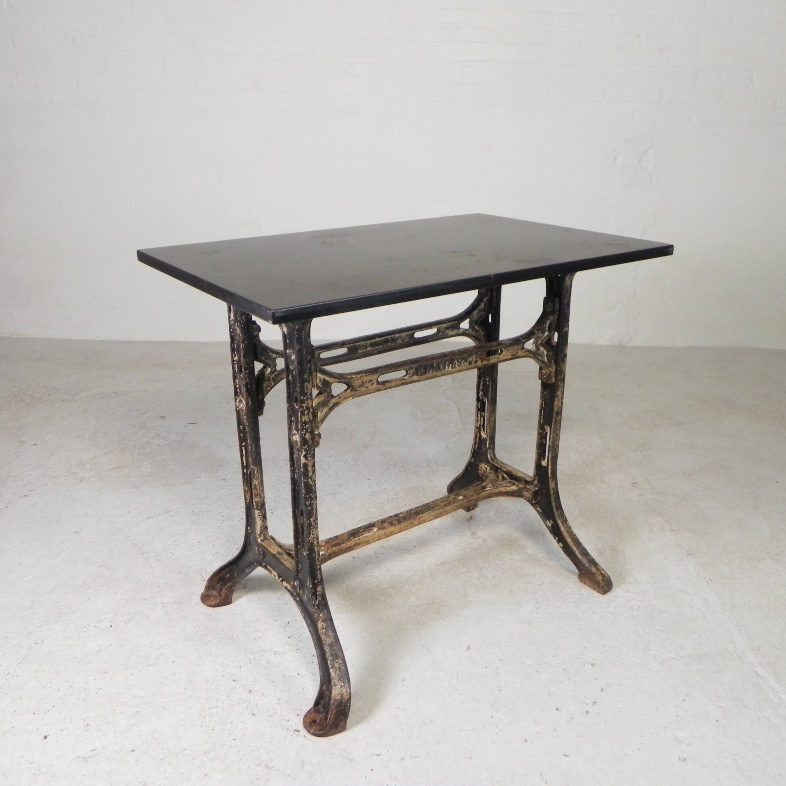 Industrial table, garden table with hard stone slab on cast iron frame, 1930s