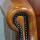 Sheepskin wingback armchair with stitching and black piping