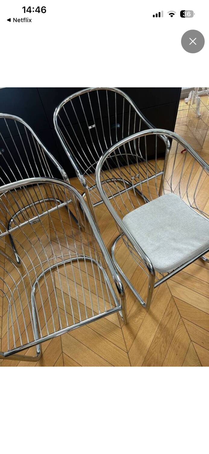 6 chrome metal chairs in the style of Gastonne Ronaldo.