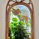 Arched Spanish wall mirror in rattan and bamboo, 1960s.