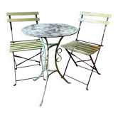 Vintage bistro set in wrought iron – 1930s table and folding chairs.