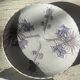 Pair of plates with blue thistles.