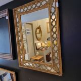 Mirror with parecloses
