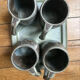 Set of 4 cups and 1 signed brutalist tray.