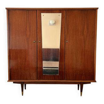 Vintage wardrobe with shelves and lacquered interior mirror.