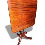 19th-century solid mahogany tilting table with a brass mechanism.