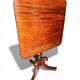 19th-century solid mahogany table with a tilting top and brass mechanism.