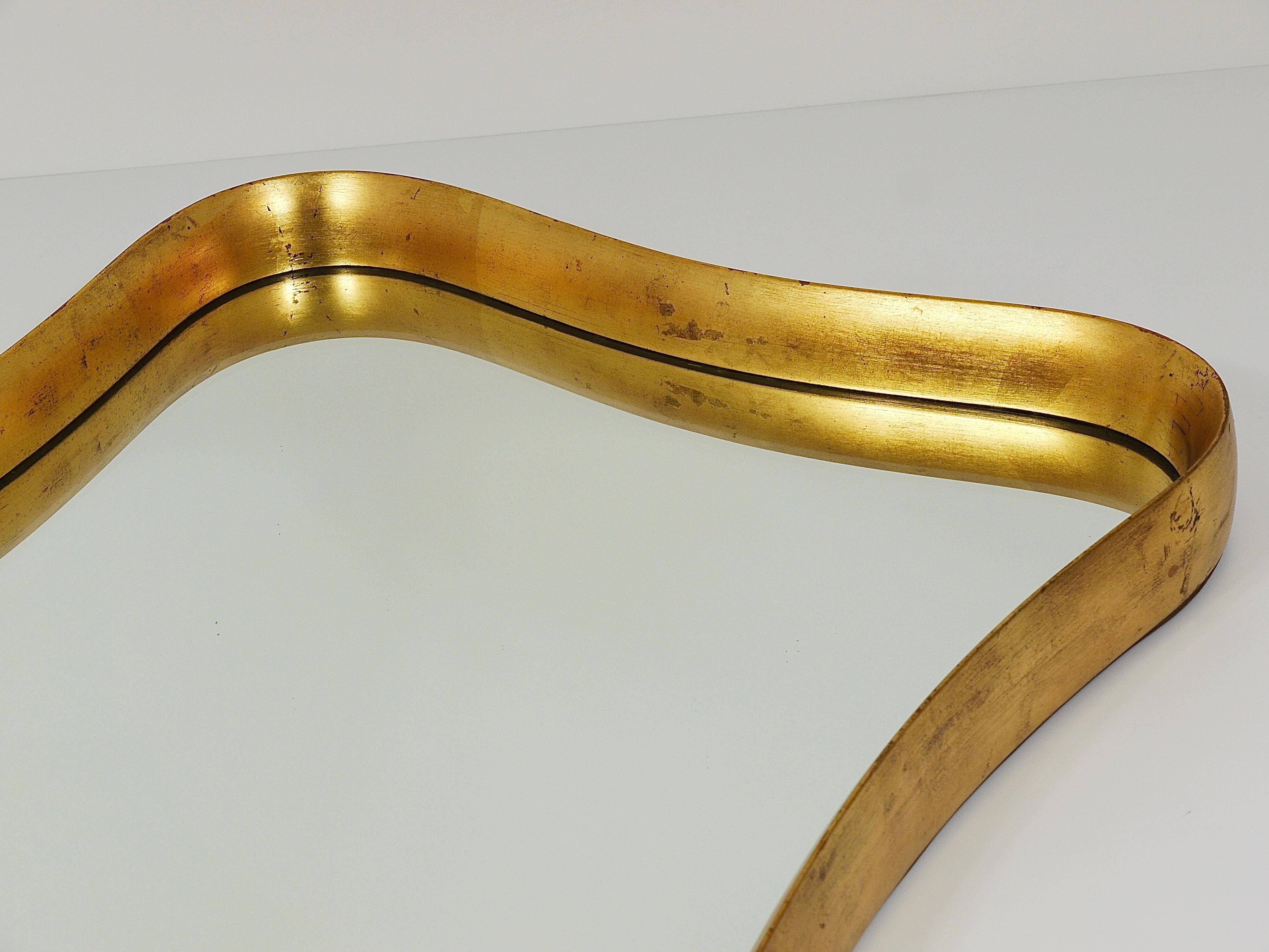 Golden wooden mirror in the style of Gio Ponti by Max Welz, Vienna, Austria, 1940s.
