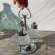Silver-plated metal and glass salt and pepper shakers