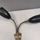 Older wall lamp with black metal shades and brass bend ‘arms’
