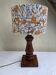 Vintage turned wood table lamp with floral drum shade.