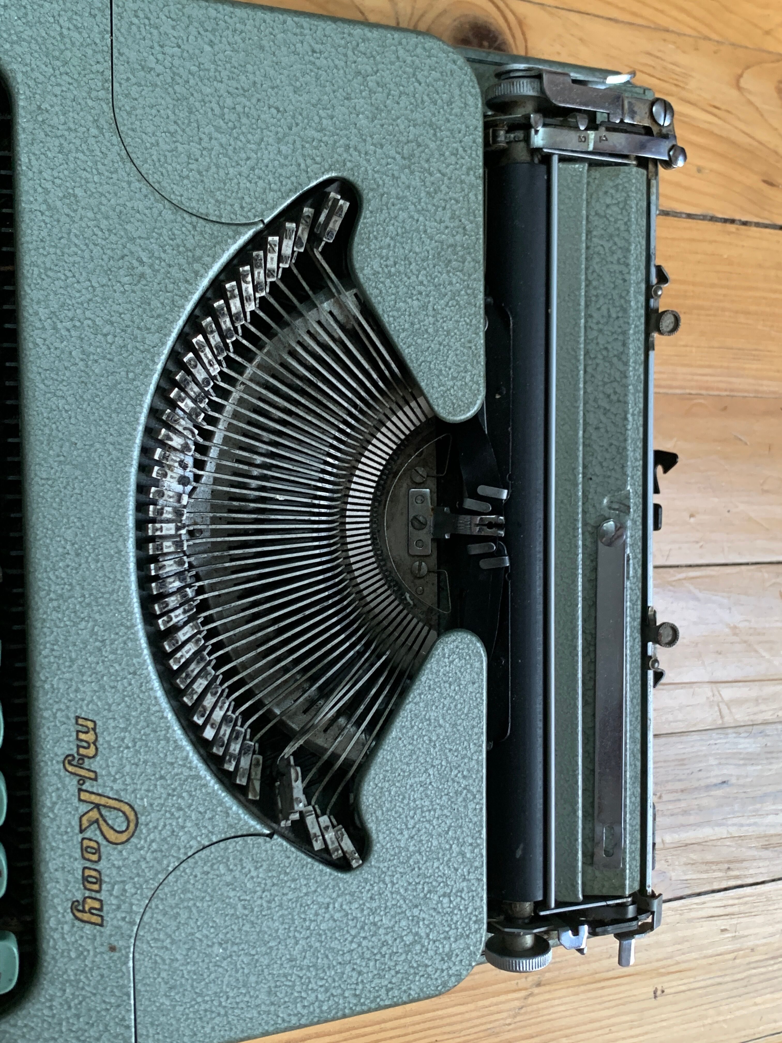 M.J. Rooy light green typewriter