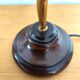 Gold swan neck table lamp with amber tulip glass.