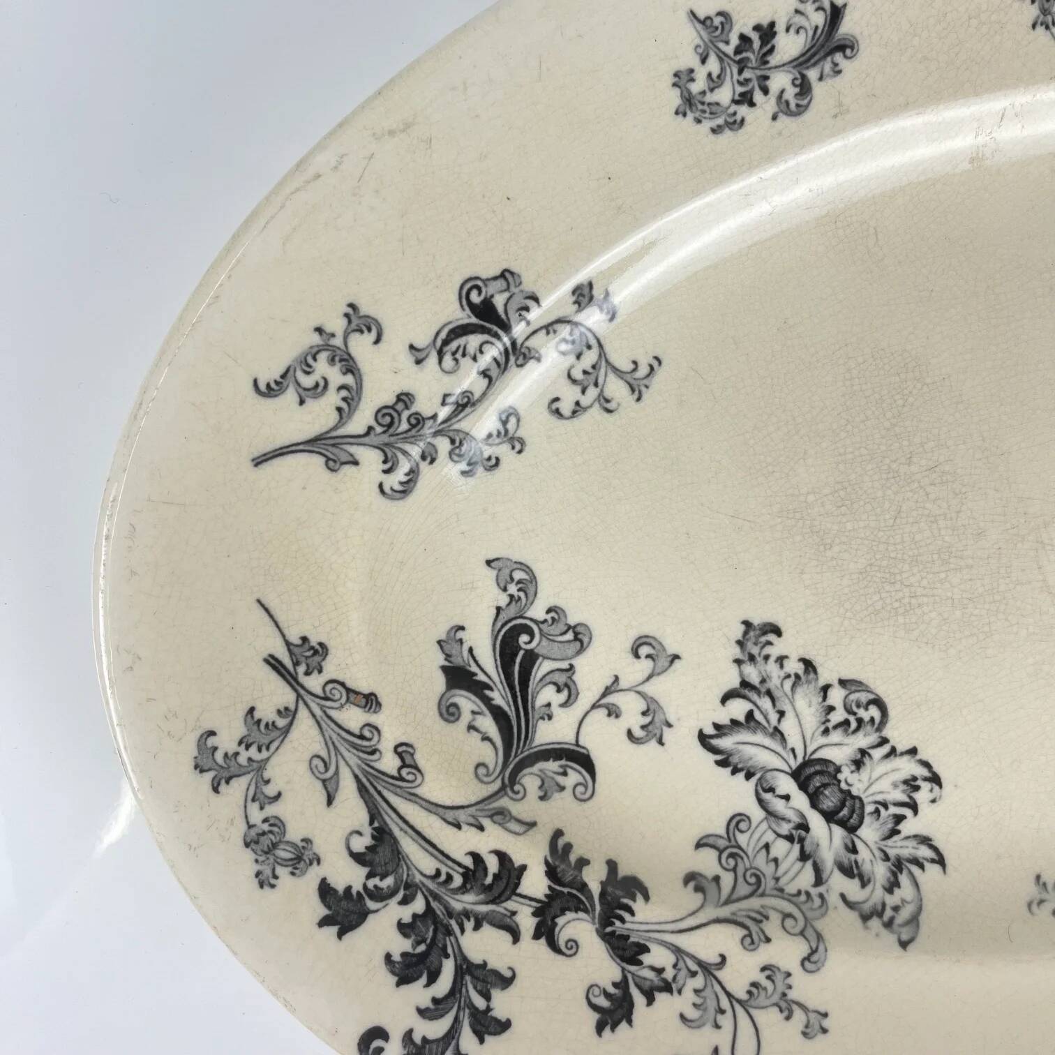 Large oval ironstone dish, "Damas" pattern by Sarreguemines, late 19th century, grey-black.