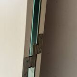 Large round triptych mirror with ivory background and back, 1970s design.