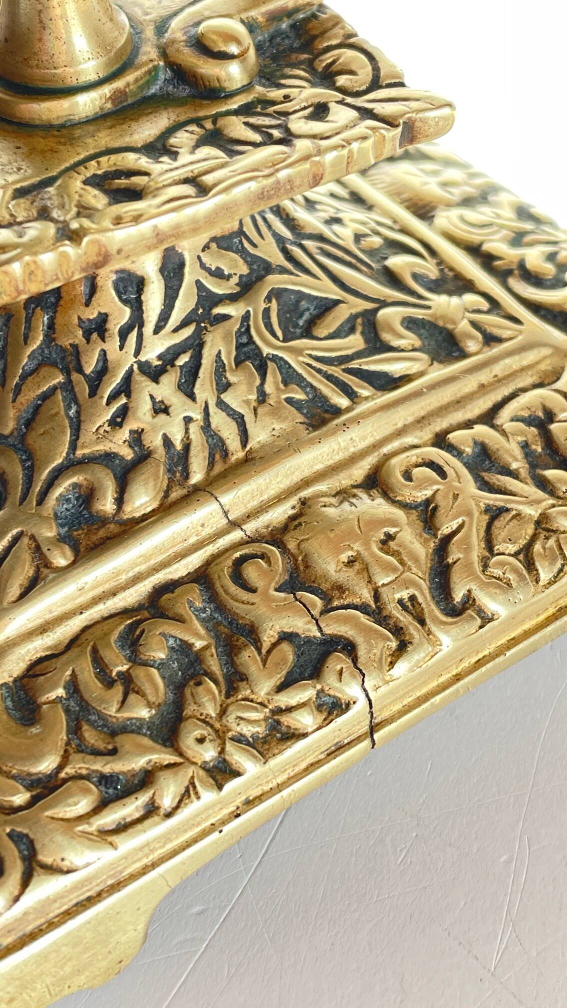 Patterned solid bronze hand candle holder