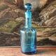 Large blown crystal bottle, twisted, turquoise blue, early 20th century.