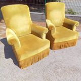 Paire de fauteuils à franges velours doré
