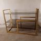 Brass shelf, smoked glass