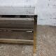 1970s coffee table in brass with a double smoked glass top.