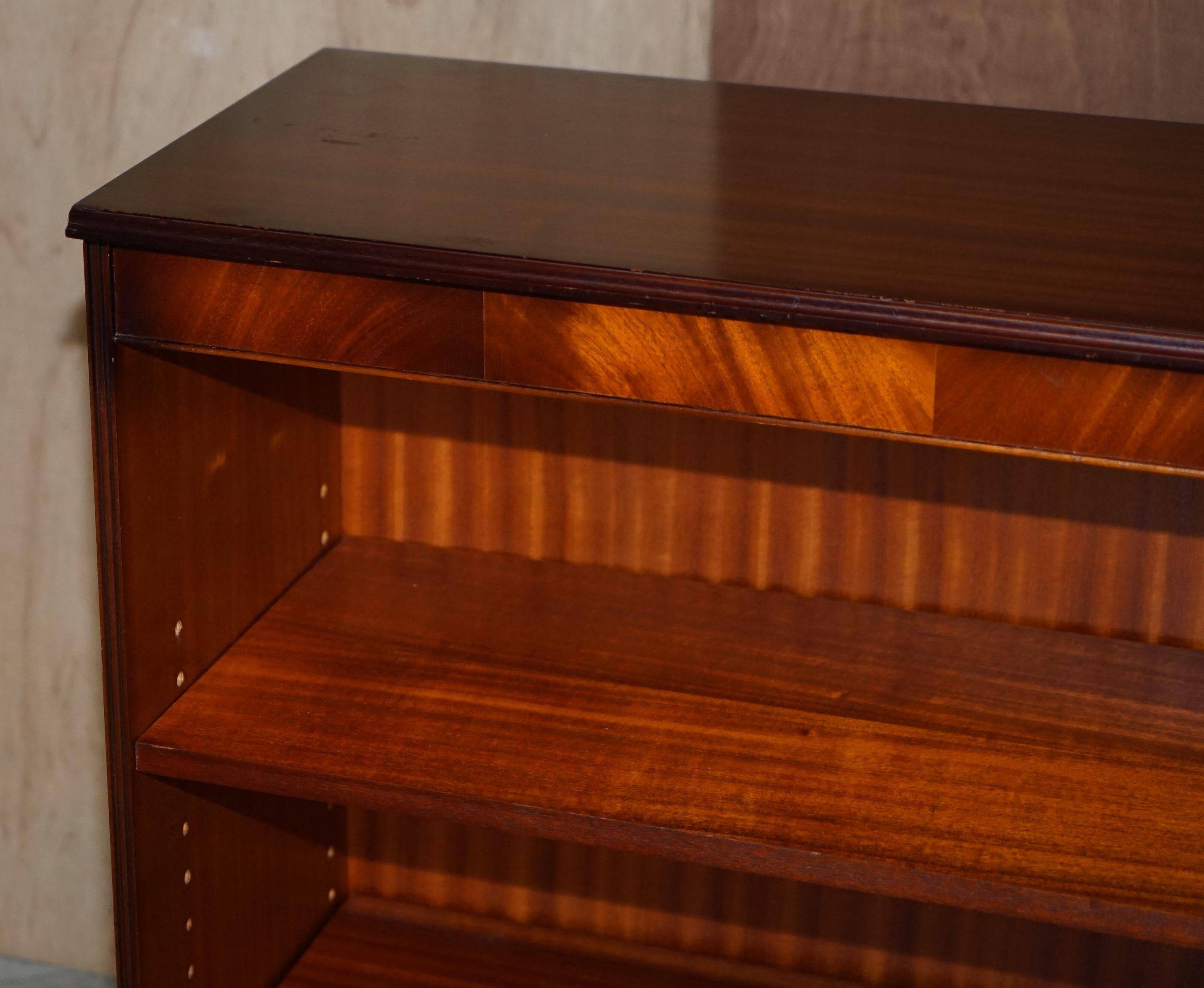Pair of open low bookshelves Shaws of London in hardwood.
