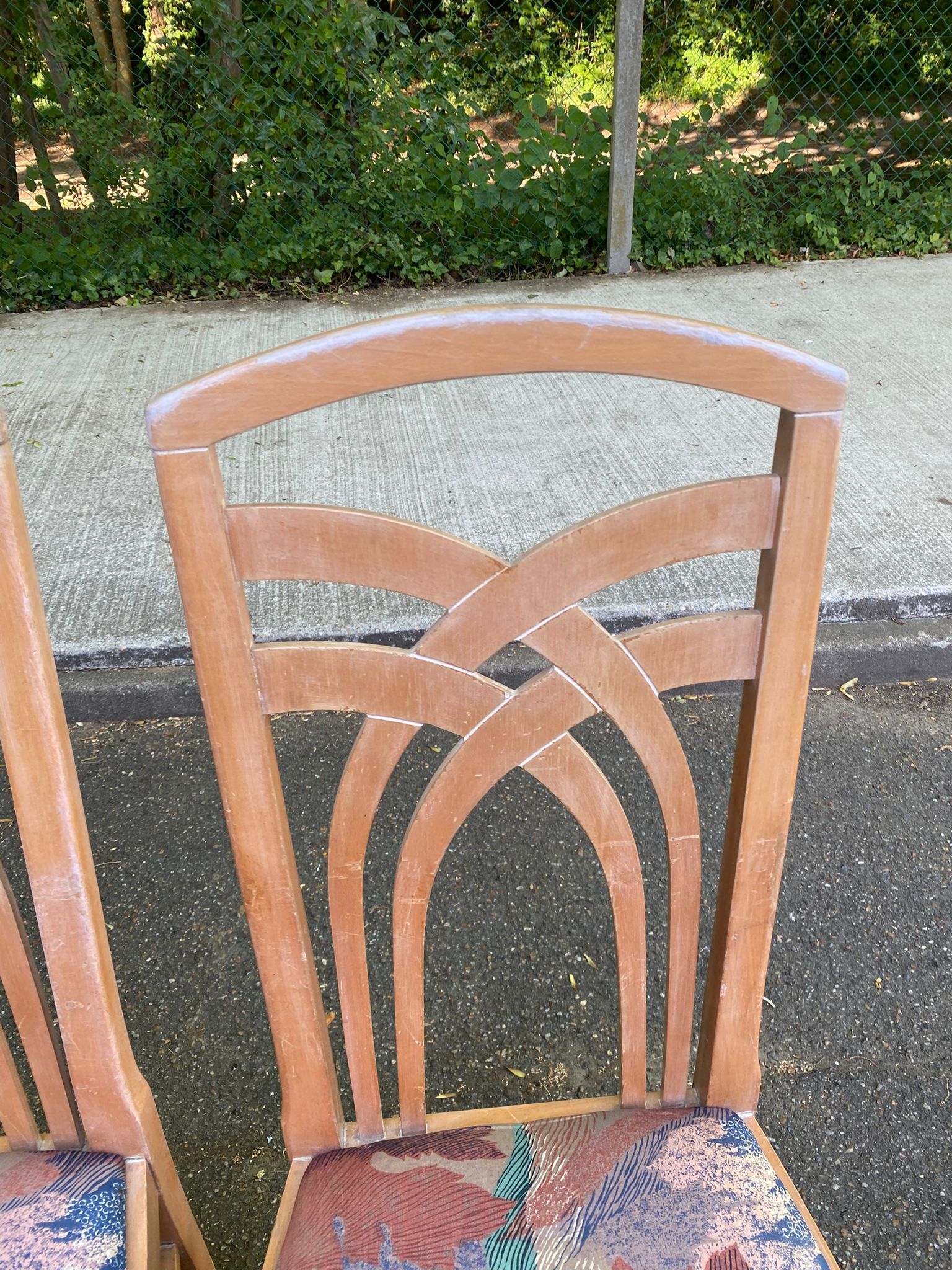 2 dining or kitchen chairs with high backs and fabric.