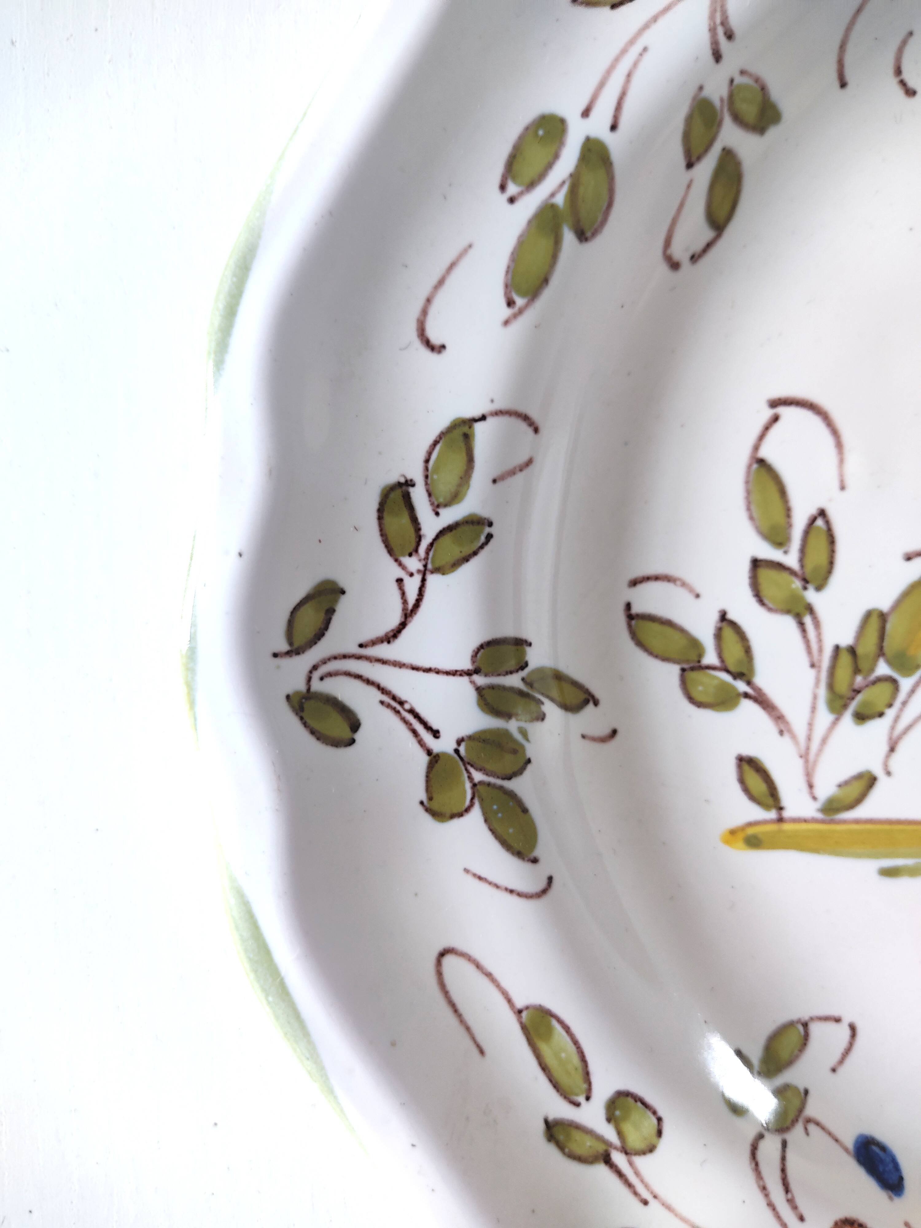 Moustiers earthenware decorative plate with bird