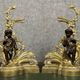 Pair of gilded bronze and patinated bronze andirons depicting putti circa 1850